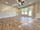 Spacious living room with rear access features durable laminate flooring at 5720 Urban Village Way # 7, Tucker, GA 30084