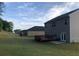 Expansive backyard featuring a wooden deck and plenty of green space, perfect for outdoor activities at 9405 Bandywood Dr, Covington, GA 30014