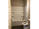Bathroom with a tub shower combo with white surrounds and tile flooring at 9405 Bandywood Dr, Covington, GA 30014