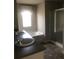 Bright bathroom with double sinks, a soaking tub, and a separate shower, creating a spa-like experience at 9405 Bandywood Dr, Covington, GA 30014
