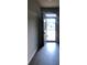 Welcoming foyer with dark hardwood flooring, a transom window, and a front door offering an inviting entrance at 9405 Bandywood Dr, Covington, GA 30014