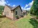 The home's backyard features a manicured lawn and tidy landscaping, creating a private outdoor setting at 2826 Staunton Dr, Duluth, GA 30097