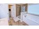Bathroom featuring a walk-in shower, and a soaking tub with tile surround at 2826 Staunton Dr, Duluth, GA 30097