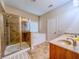 This bathroom features a glass shower, soaking tub, double vanity and tile flooring at 2826 Staunton Dr, Duluth, GA 30097