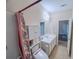 Bright bathroom features a tub/shower combo, single sink vanity, and neutral color palette at 2826 Staunton Dr, Duluth, GA 30097