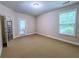 Bedroom featuring carpet floors, base molding, natural light and glass panel door at 2826 Staunton Dr, Duluth, GA 30097