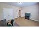 This bedroom has carpet flooring, neutral walls, and a TV on a stand at 2826 Staunton Dr, Duluth, GA 30097