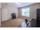 This bedroom has carpet flooring, neutral walls and a window for natural light at 2826 Staunton Dr, Duluth, GA 30097