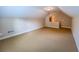 A large bonus room is featured with carpeted floors, base molding, and natural light at 2826 Staunton Dr, Duluth, GA 30097