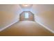 A large bonus room is featured with carpeted floors and natural light at 2826 Staunton Dr, Duluth, GA 30097
