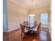 Elegant dining room with hardwood floors, white wainscoting, and a decorative chandelier at 2826 Staunton Dr, Duluth, GA 30097