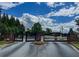 Gated entrance with brick columns and security gate, providing privacy and exclusivity to the community at 2826 Staunton Dr, Duluth, GA 30097