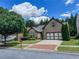 Beautiful brick home boasting an attached two-car garage, brick driveway, and mature landscaping at 2826 Staunton Dr, Duluth, GA 30097