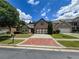 Charming brick home featuring a spacious driveway, a two-car garage, and a beautifully landscaped yard at 2826 Staunton Dr, Duluth, GA 30097
