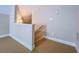 Hallway with beige carpet flooring and white trim offers a neutral design at 2826 Staunton Dr, Duluth, GA 30097