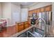 Well-lit kitchen featuring hardwood floors, stainless appliances, and an eat-in area at 2826 Staunton Dr, Duluth, GA 30097