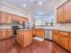 Modern kitchen featuring an island, stainless steel appliances, and hardwood floors at 2826 Staunton Dr, Duluth, GA 30097