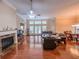 Open living room with hardwood floors, fireplace, and large windows, perfect for entertaining at 2826 Staunton Dr, Duluth, GA 30097