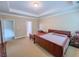 A bright main bedroom featuring tray ceilings and neutral walls at 2826 Staunton Dr, Duluth, GA 30097