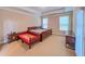 Spacious main bedroom with neutral carpet, tray ceiling, and generous natural light at 2826 Staunton Dr, Duluth, GA 30097