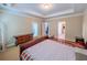 Main bedroom featuring a neutral color palette and tray ceiling at 2826 Staunton Dr, Duluth, GA 30097