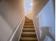 View of carpeted stairs with handrail leading to the upper floor at 2826 Staunton Dr, Duluth, GA 30097