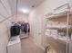 Walk-in closet with metal racks for clothes and a built-in bench to one side at 2826 Staunton Dr, Duluth, GA 30097