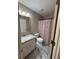 Bathroom with a single sink vanity and a shower with decorative curtain at 42 Grant Nw Dr, Cartersville, GA 30121