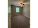 Bedroom with neutral carpet, ceiling fan and natural light from a window at 42 Grant Nw Dr, Cartersville, GA 30121