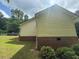 Exterior view of home, with the brick detail, lawn, and green trees at 42 Grant Nw Dr, Cartersville, GA 30121