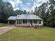 Charming single-story home featuring a metal roof, carport, and well-maintained lawn at 42 Grant Nw Dr, Cartersville, GA 30121