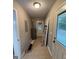 Home's hallway with tile floors, water heater, and a door to the backyard at 42 Grant Nw Dr, Cartersville, GA 30121