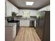 Kitchen featuring white cabinets, stainless steel appliances, and granite countertops at 42 Grant Nw Dr, Cartersville, GA 30121