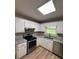 Bright kitchen with white cabinets, stainless steel appliances, and granite countertops at 42 Grant Nw Dr, Cartersville, GA 30121