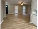 Spacious living room featuring light wood floors, neutral walls, and natural light from two windows at 42 Grant Nw Dr, Cartersville, GA 30121