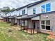 Row of townhomes featuring cozy, covered back porches ideal for outdoor relaxation at 5722 Urban Village Way # 8, Tucker, GA 30084