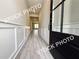 Stylish entryway with wainscoting and hardwood flooring, creating an inviting ambiance at 5722 Urban Village Way # 8, Tucker, GA 30084