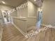 Bright hallway with wood-look flooring and white trim, providing access to multiple rooms at 5722 Urban Village Way # 8, Tucker, GA 30084