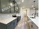 Bright kitchen with gray cabinets, stainless steel appliances, white countertops, and an island with a sink at 5722 Urban Village Way # 8, Tucker, GA 30084