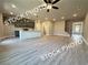 Open-concept living area merges seamlessly into the kitchen and entry stairs for easy modern living at 5722 Urban Village Way # 8, Tucker, GA 30084