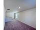 Large open loft with plush carpeting, natural light and a neutral color palette at 7731 Sudbury Cir, Covington, GA 30014