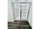 New shower featuring a sliding glass door, shelving, and a modern fixture at 7731 Sudbury Cir, Covington, GA 30014