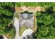 A bird's eye view of a well maintained home surrounded by lush green trees and landscaping at 922 Pebblebrook Se Rd, Mableton, GA 30126