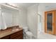 Well-maintained bathroom featuring a vanity with granite countertop and walk-in shower at 922 Pebblebrook Se Rd, Mableton, GA 30126