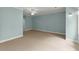 Spacious bedroom with soft blue walls, carpet, a ceiling fan and multiple doorways at 922 Pebblebrook Se Rd, Mableton, GA 30126