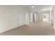 Large bonus room with multiple doorways, neutral carpet, and bright natural light, offering versatility for various uses at 922 Pebblebrook Se Rd, Mableton, GA 30126