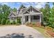Charming home with stone accents, lush landscaping, and inviting front porch offers elegant curb appeal at 922 Pebblebrook Se Rd, Mableton, GA 30126