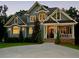 Charming craftsman home with beautiful windows, landscaping and a welcoming front porch at 922 Pebblebrook Se Rd, Mableton, GA 30126