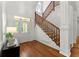 Stunning foyer with stairs, hardwood floors, classic pillars, and natural light at 922 Pebblebrook Se Rd, Mableton, GA 30126
