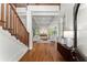 Bright foyer with hardwood floors, stairs, classic columns, and a view of the living room at 922 Pebblebrook Se Rd, Mableton, GA 30126